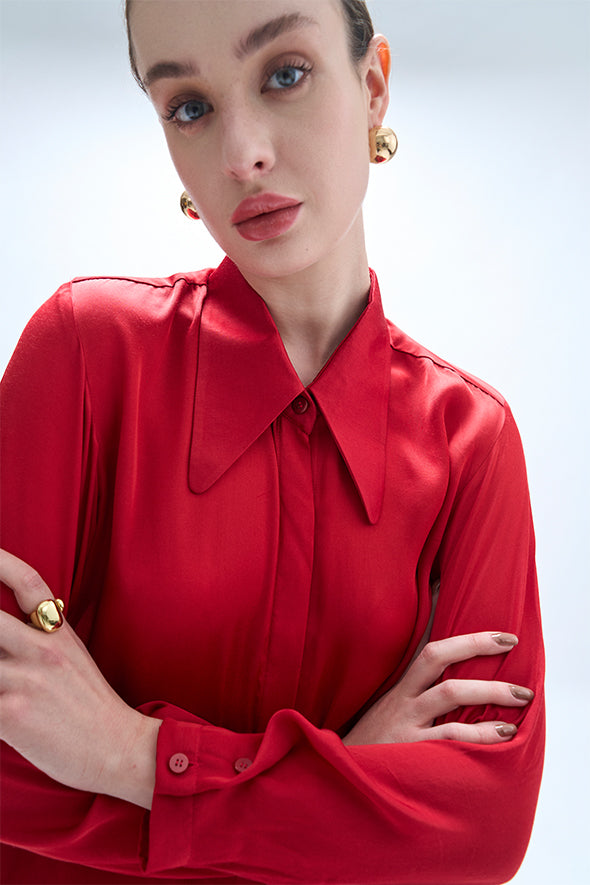 Full-sleeve red modal satin shirt featuring a high-low hem with an apple cut from Aroka.