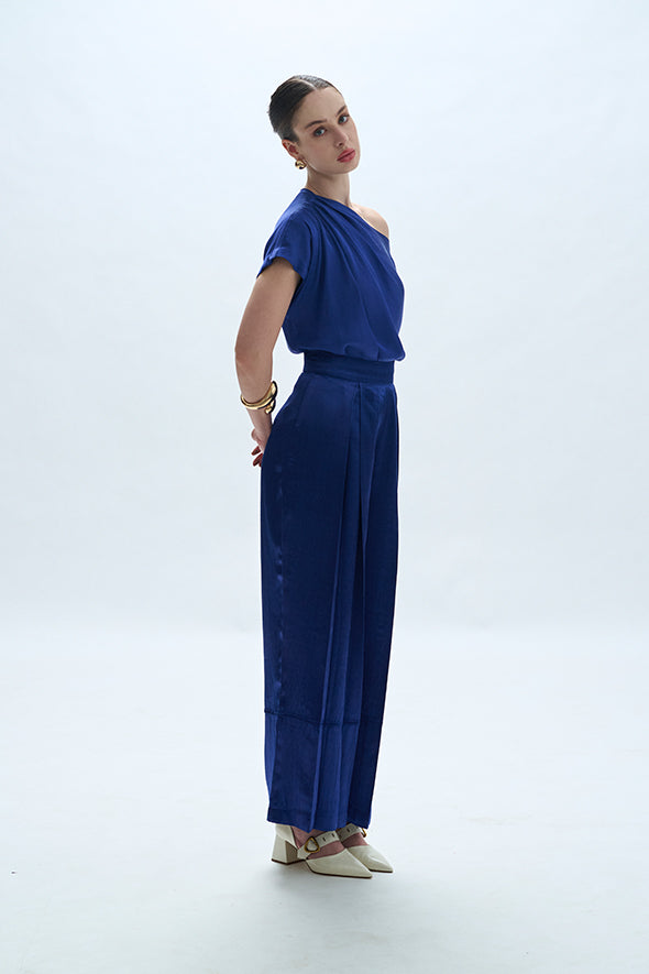 Off-shoulder cowl drape with pleated pants in blue from Aroka.