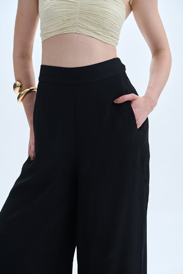 Aroka Black pants tailored from premium Moroccan crepe, offering a sleek, straight fit with welt pockets.
