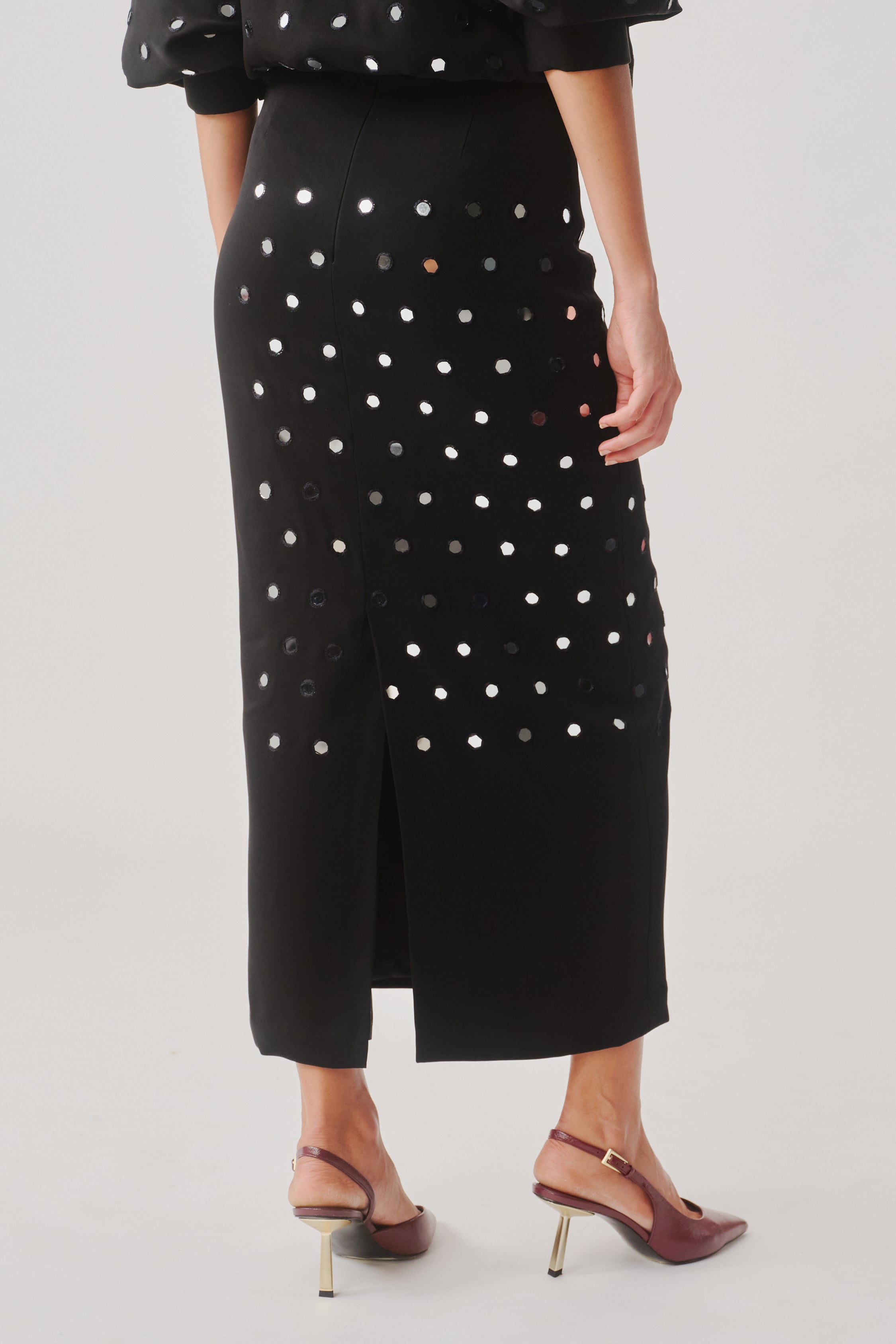 Black Constellation Skirt, side view, pleated detail