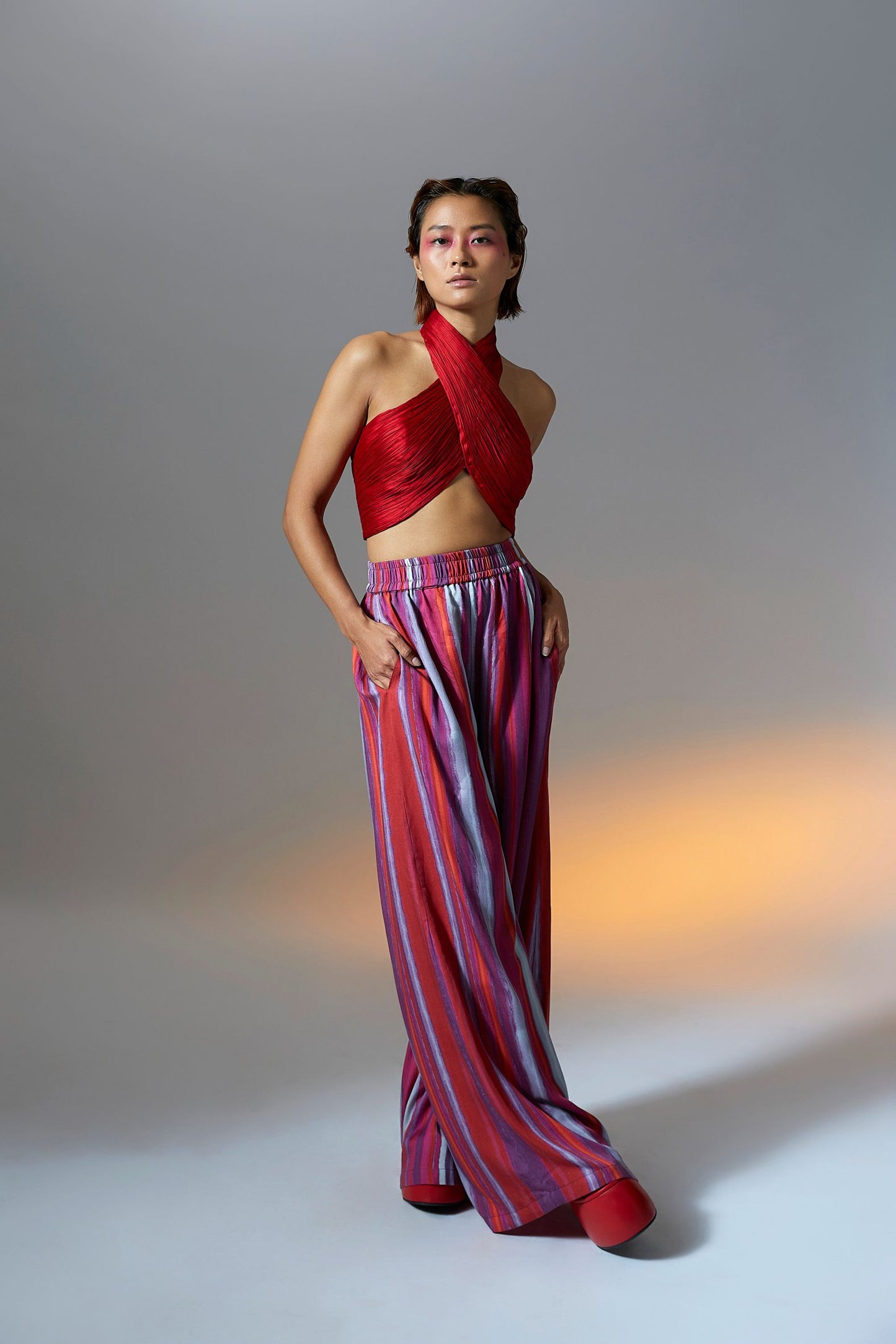 Handmade with modal satin fabric halter neck drape top in red from Aroka.