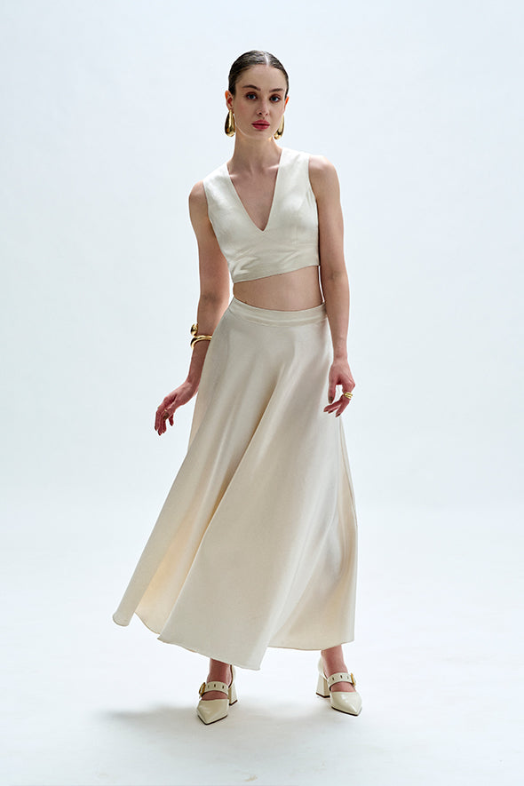 White flared skirt crafted from vegan mashru fabric with side zipper from Aroka.