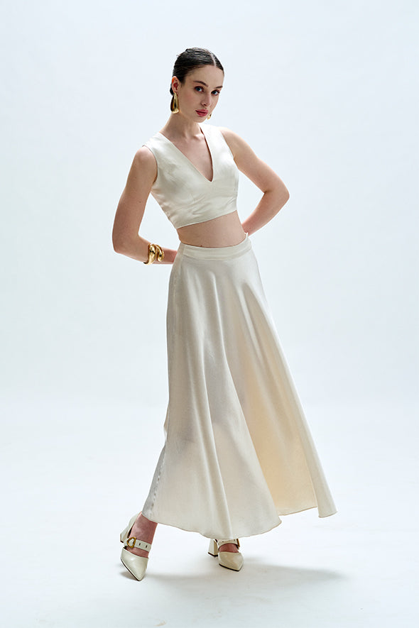 White flared skirt crafted from vegan mashru fabric with side zipper from Aroka.