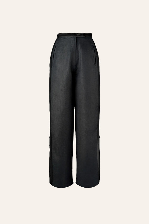 Black pants from Aroka featuring mashru side panels and a zipper that opens as a slit.