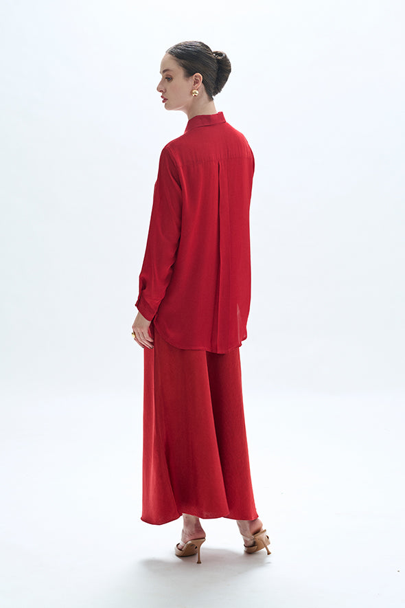 Full-sleeve red modal satin shirt featuring a high-low hem with an apple cut from Aroka.