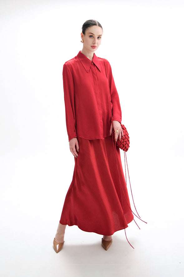 Full-sleeve red modal satin shirt featuring a high-low hem with an apple cut from Aroka.
