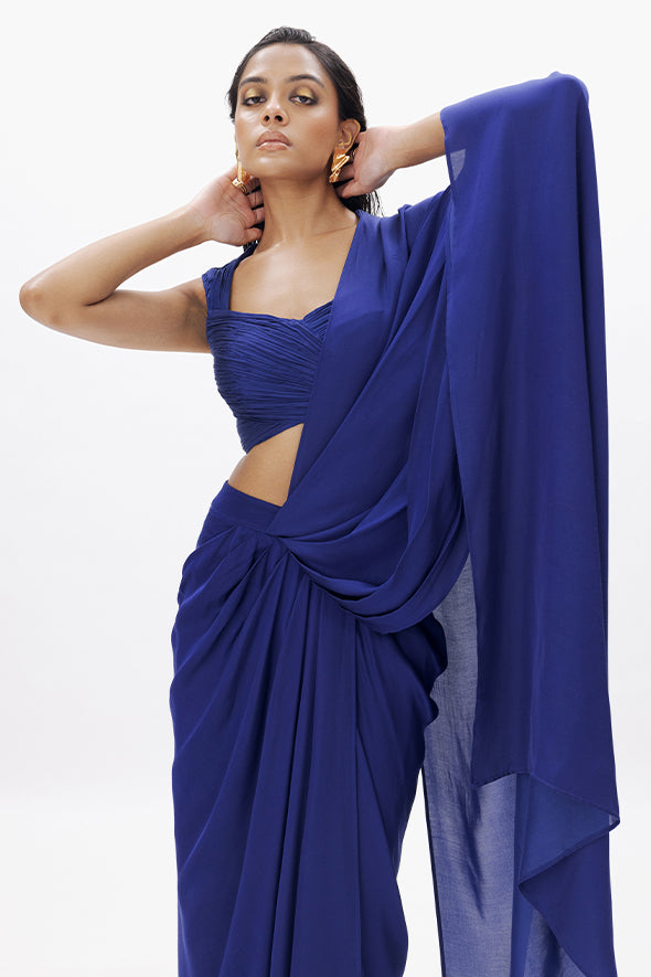 Blue ruched design with a sweetheart, incut neckline, sleeveless top with modal satin pre-draped saree for special occasions from Aroka.