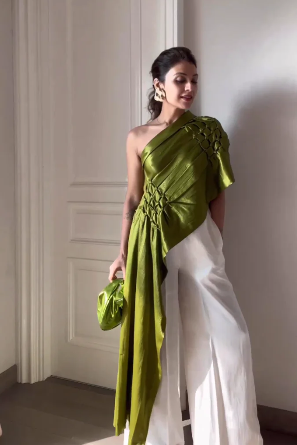 Olive draped off shoulder, asymmetric top with white wide leg pant from Aroka.