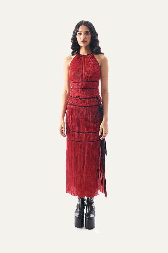 Amour halter neck top with black piping details and back tie-ups paired with Amour skirt in red from Aroka.