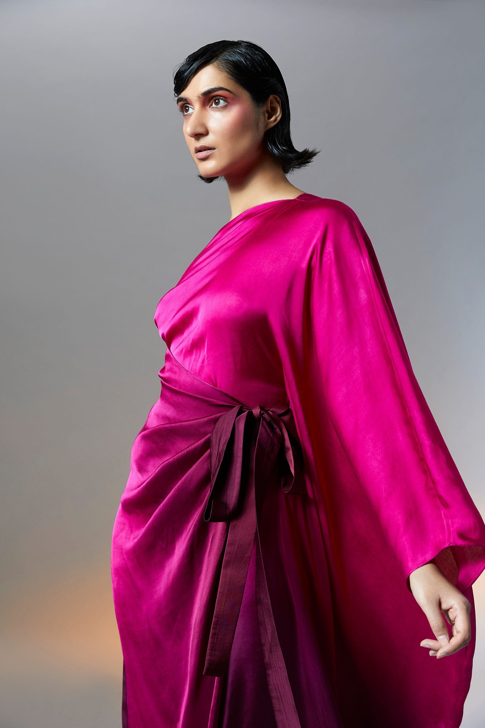 Versatile vegan satin, luxuriously soft one-shoulder kaftan dress in Ombre Pink from Aroka