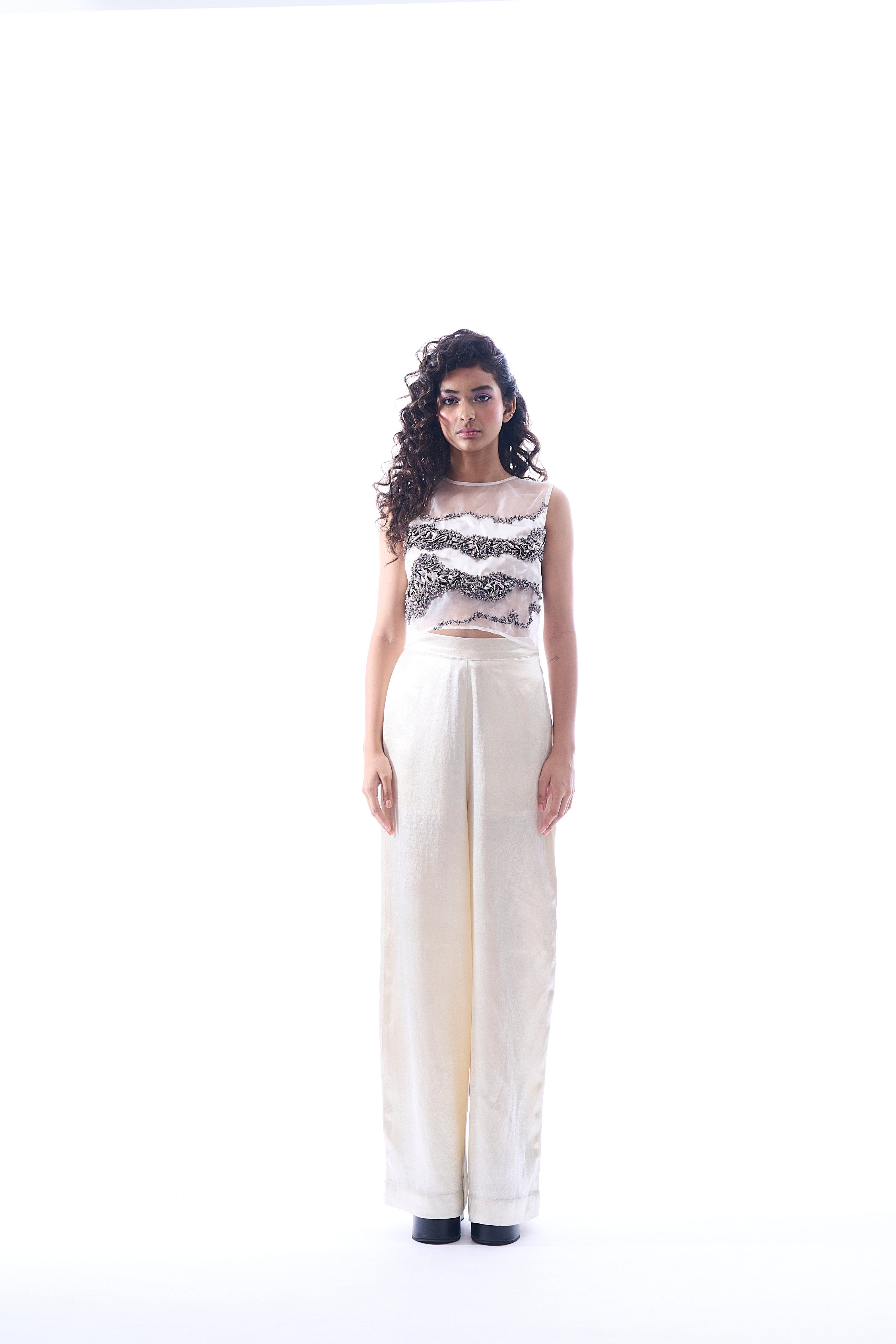 White pants made in mashru featuring wide-legged fit with side zipper from Aroka.