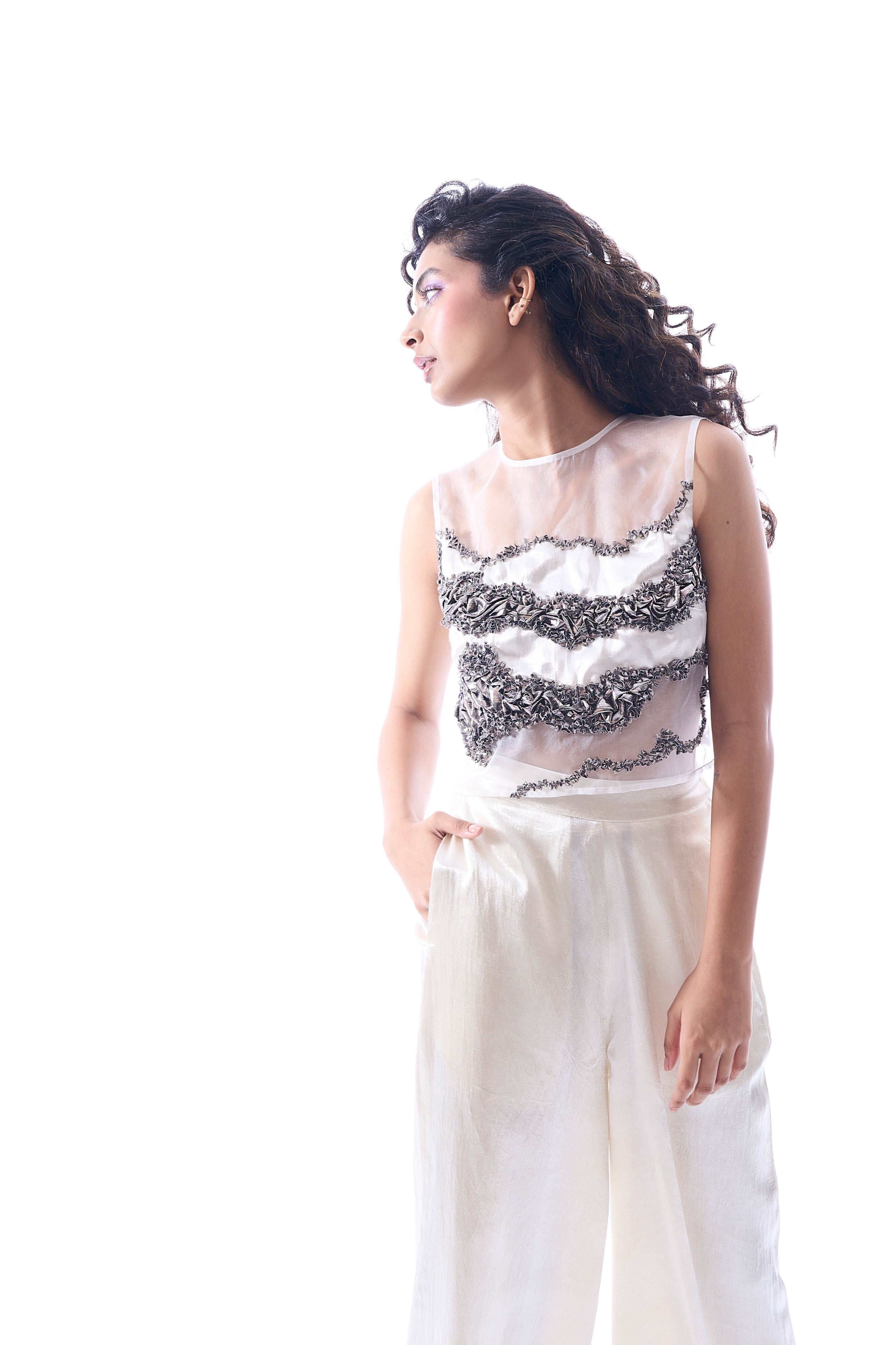 White pants made in mashru featuring wide-legged fit with side zipper from Aroka.