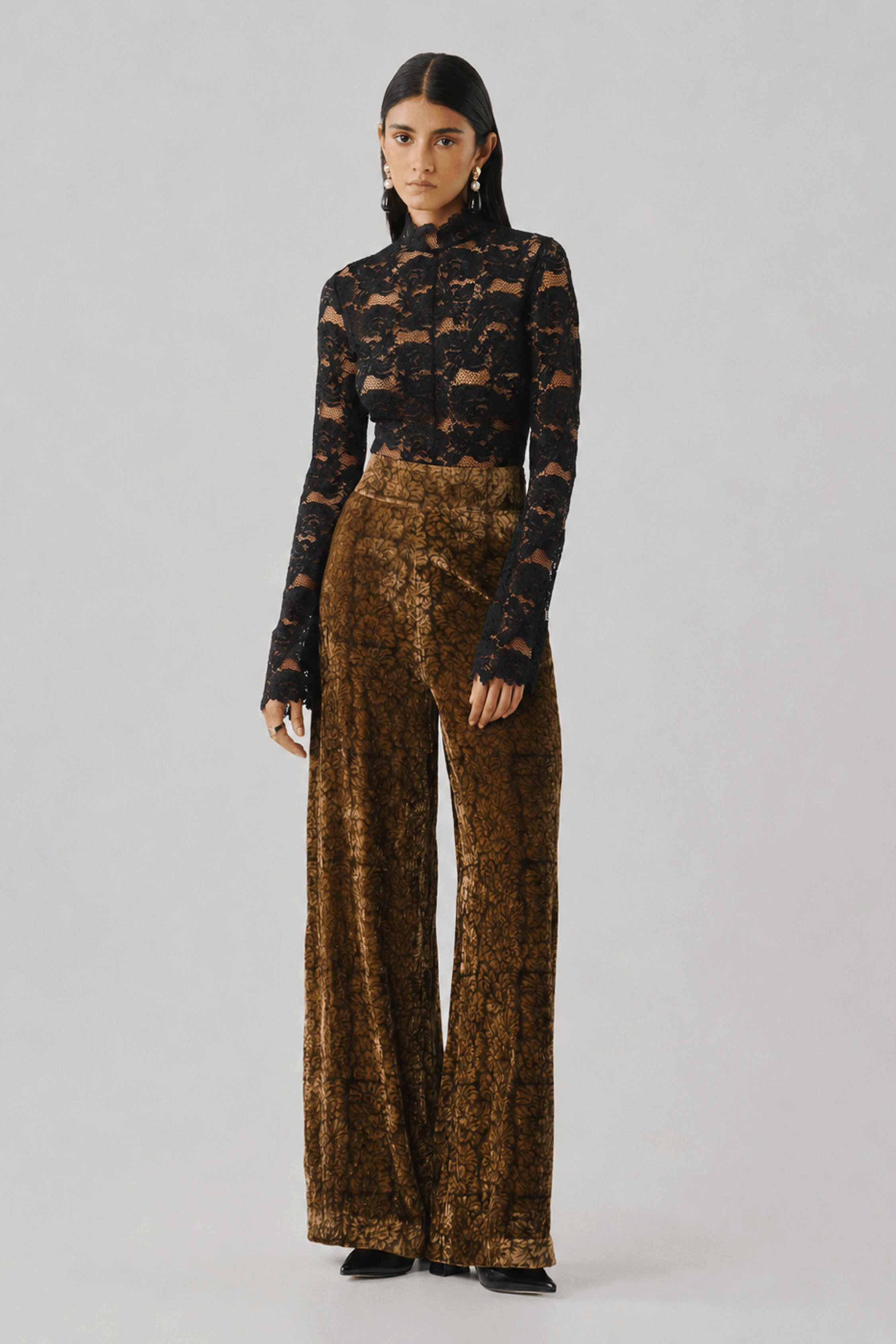 Bronze printed wide-leg trousers with a black lace top, front view