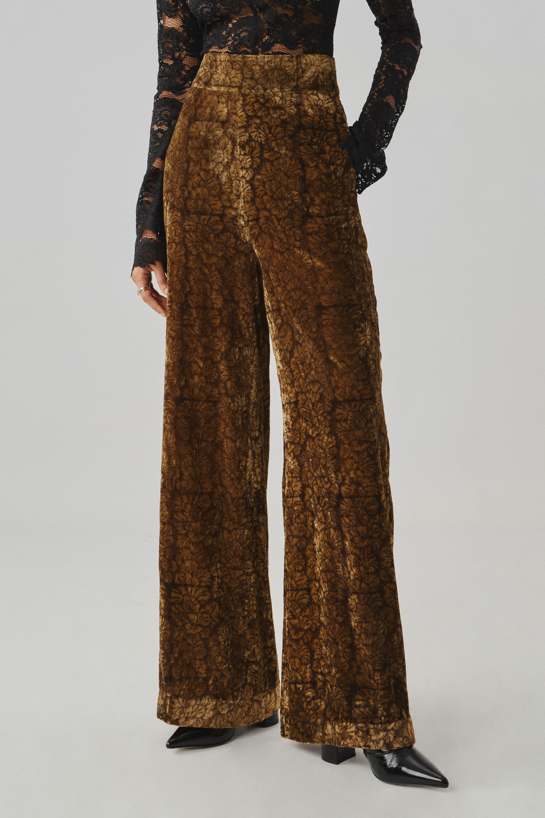 Bronze Ajrakh-print wide-leg trousers with a black top, front view