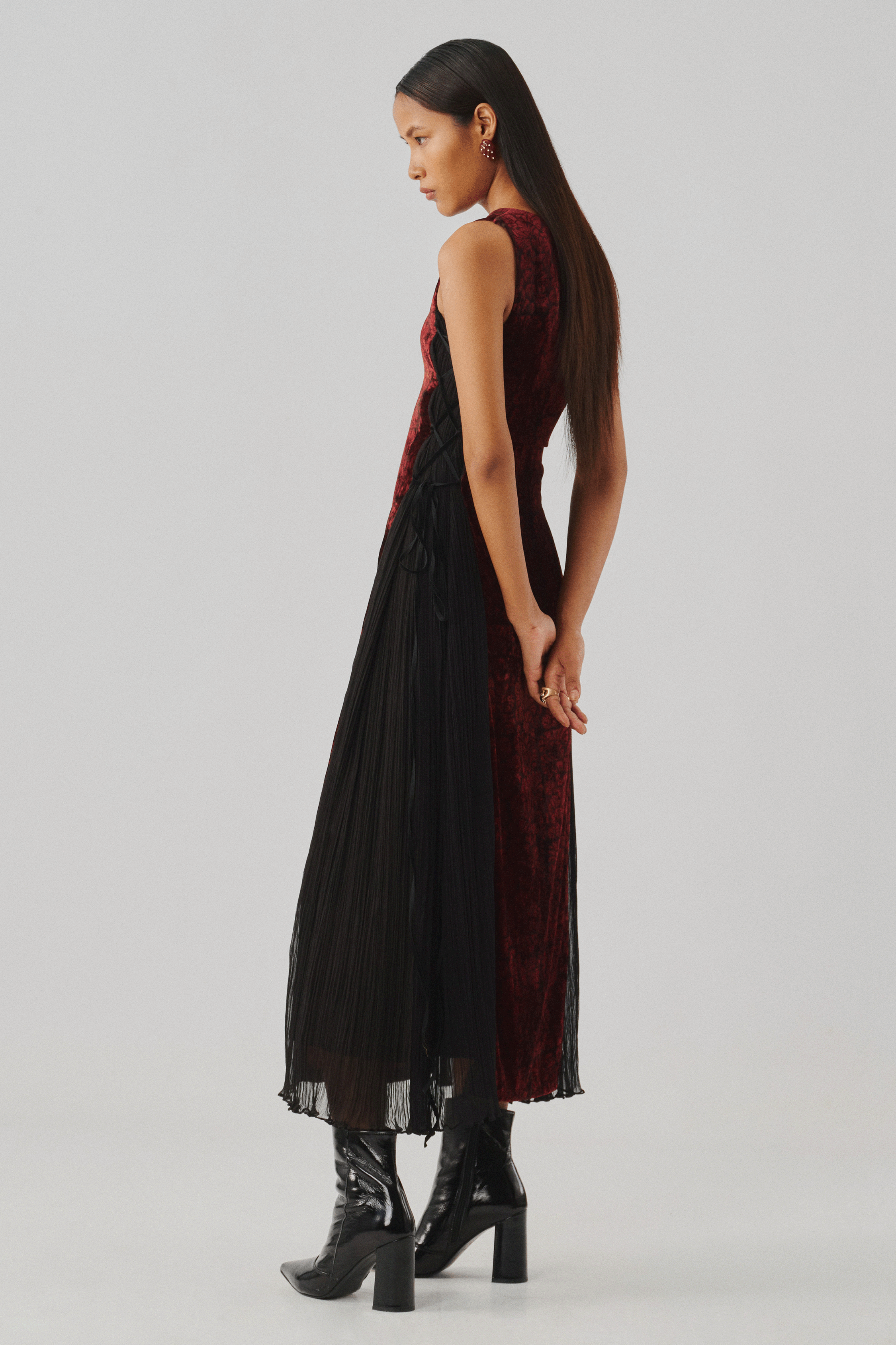 Burgundy velvet dress with a sheer panel, side profile full view