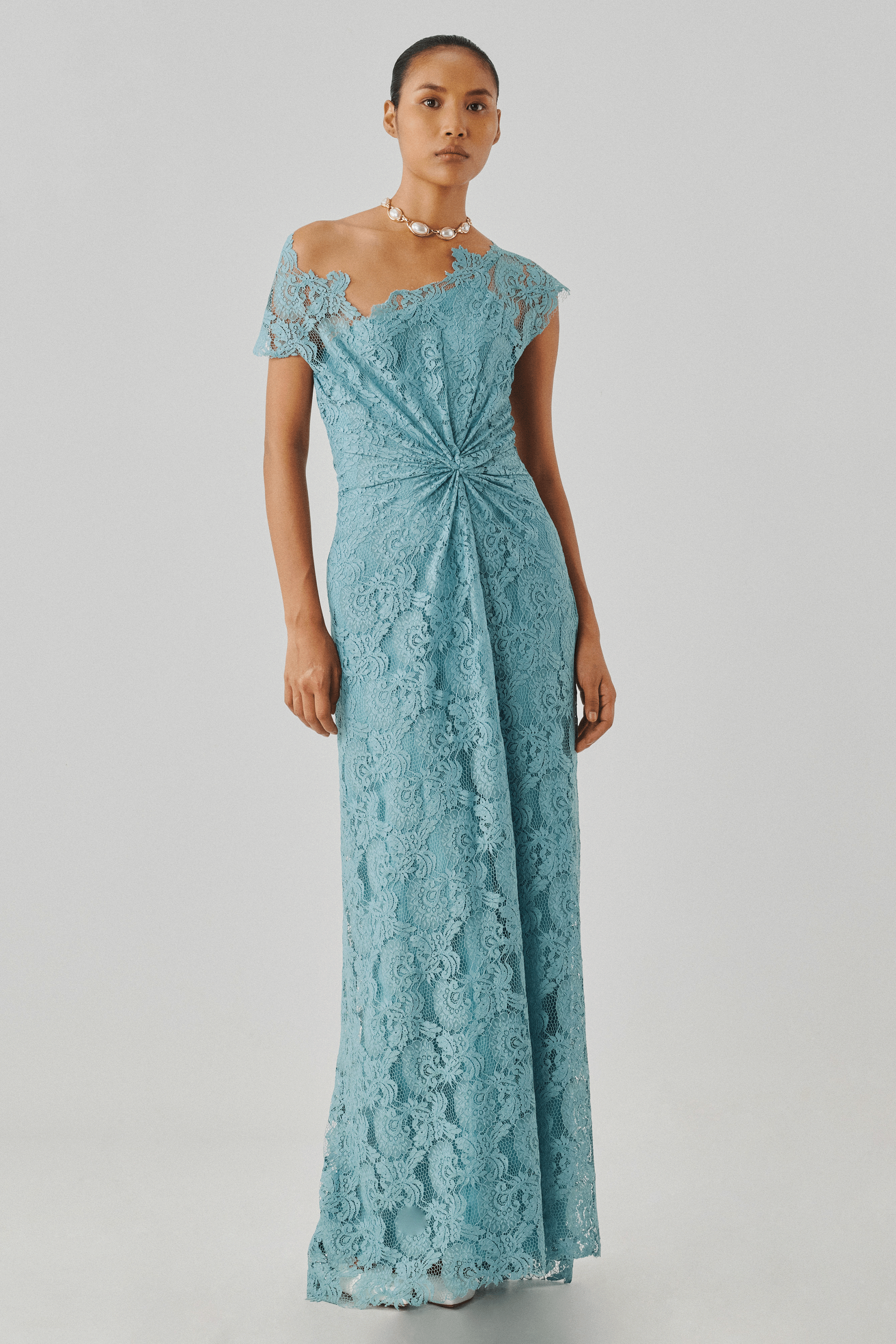 Sky blue lace gown with a fitted bodice, full-length front view