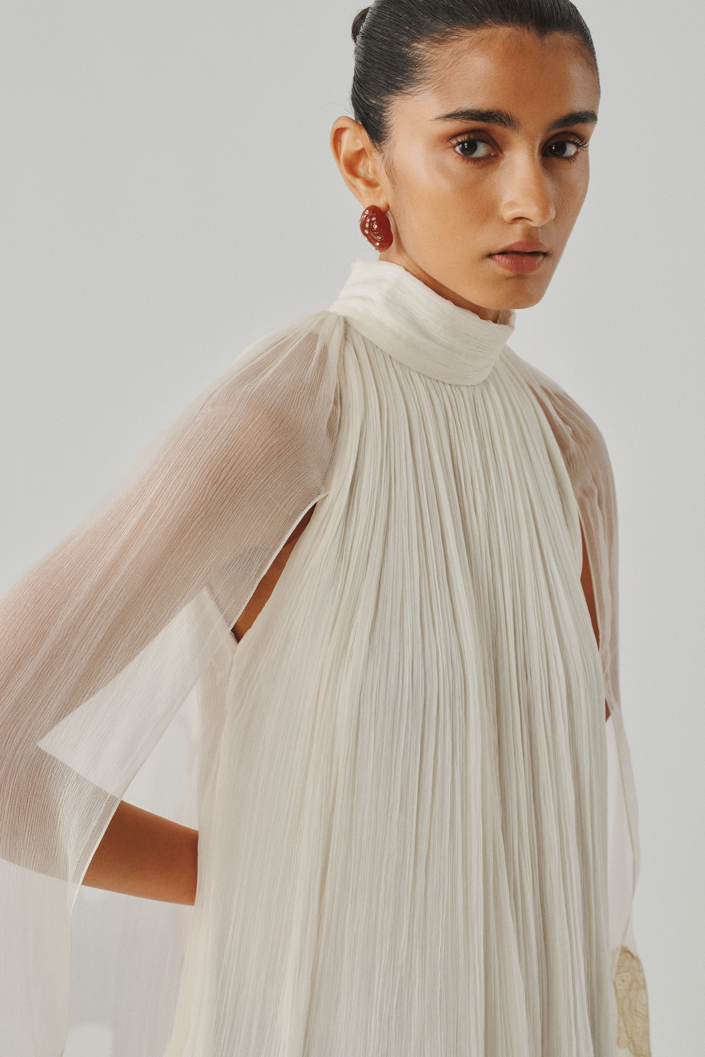 Ivory sheer cape dress with dip-dyed hem, dramatic sleeve close-up
