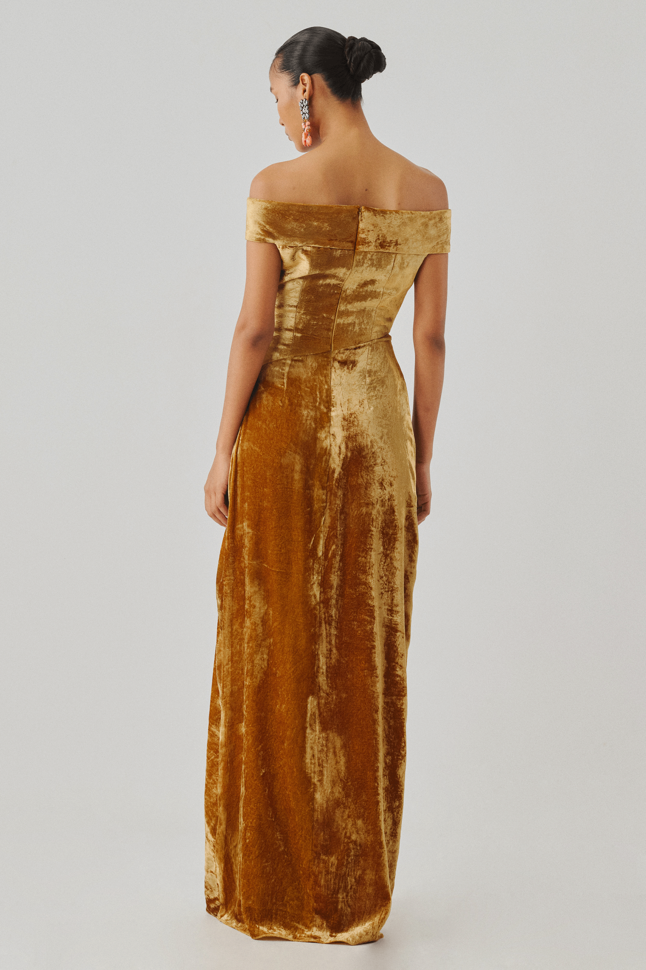 Gold velvet off-shoulder gown with draped folds, rear view