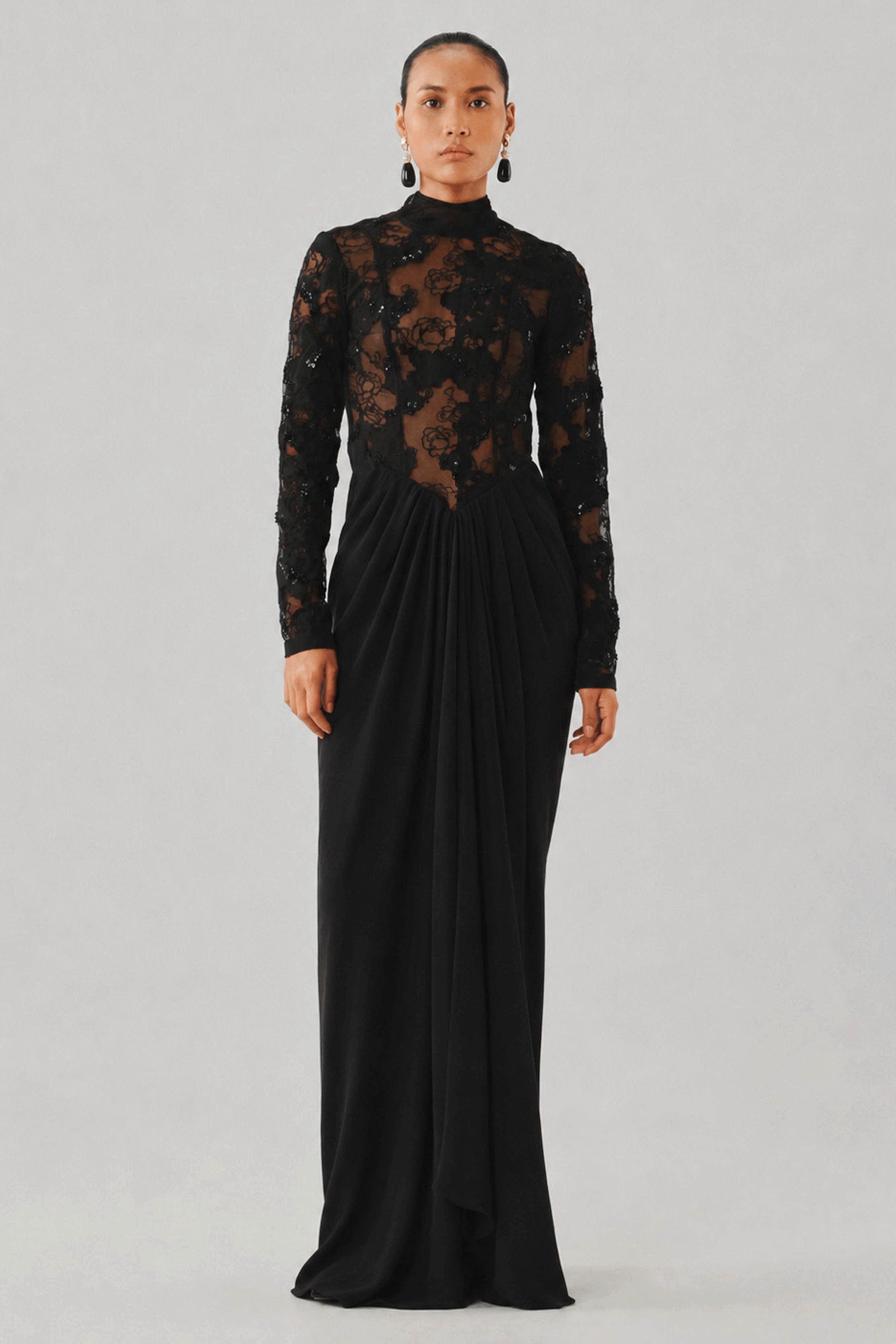 Black long-sleeve lace gown with a fitted silhouette, front view