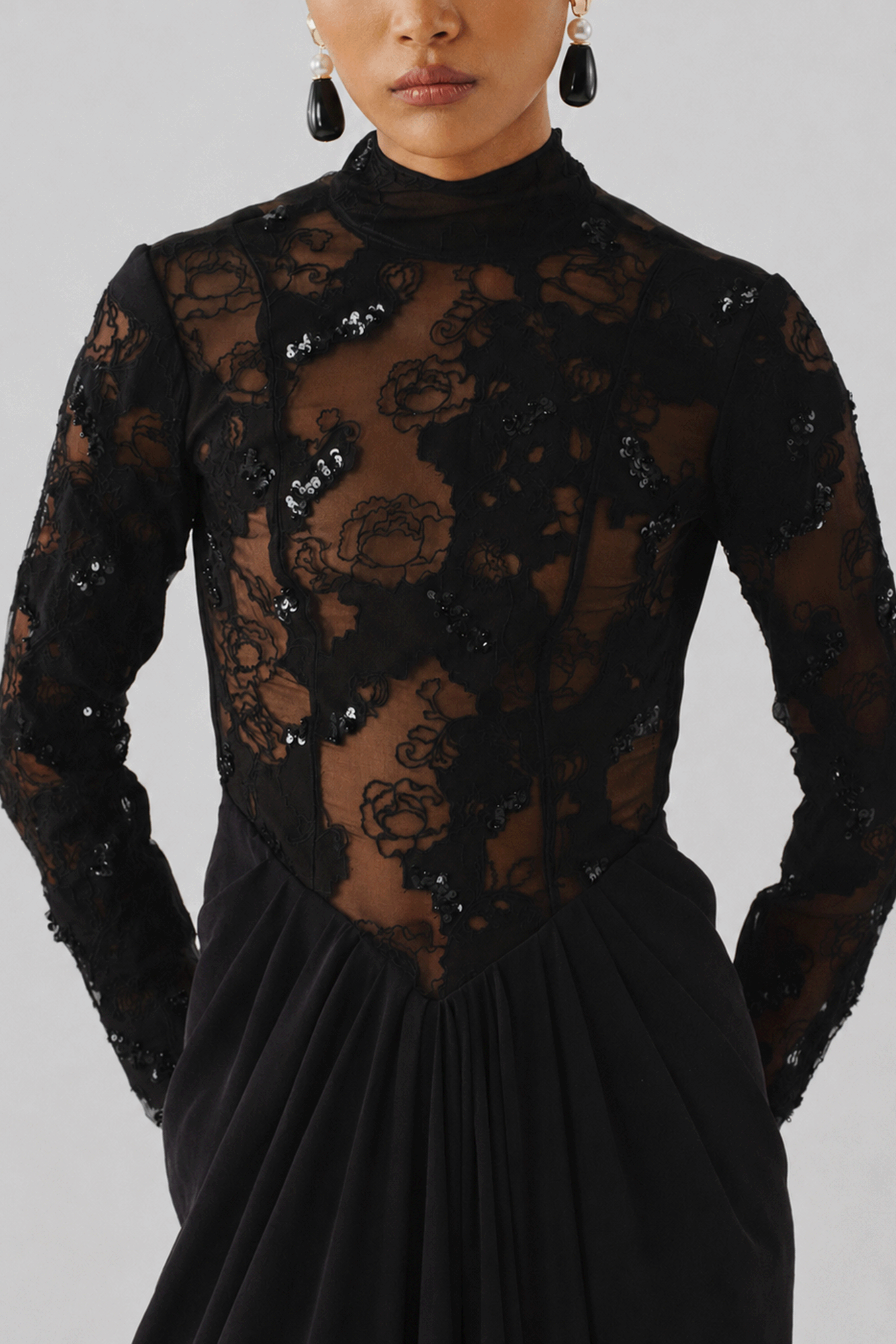 Black lace long-sleeve top with an embroidered mini skirt, front view