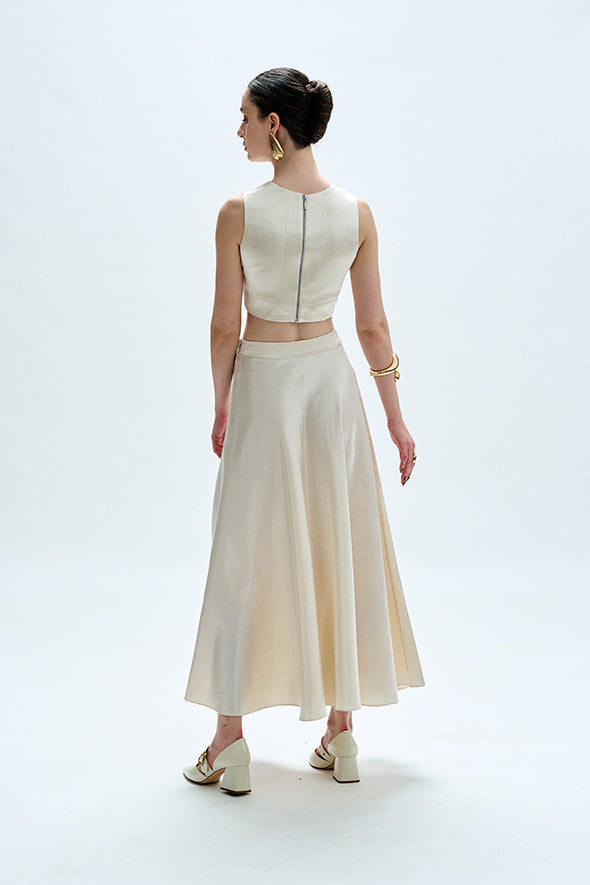 White flared skirt crafted from vegan mashru fabric with side zipper from Aroka.