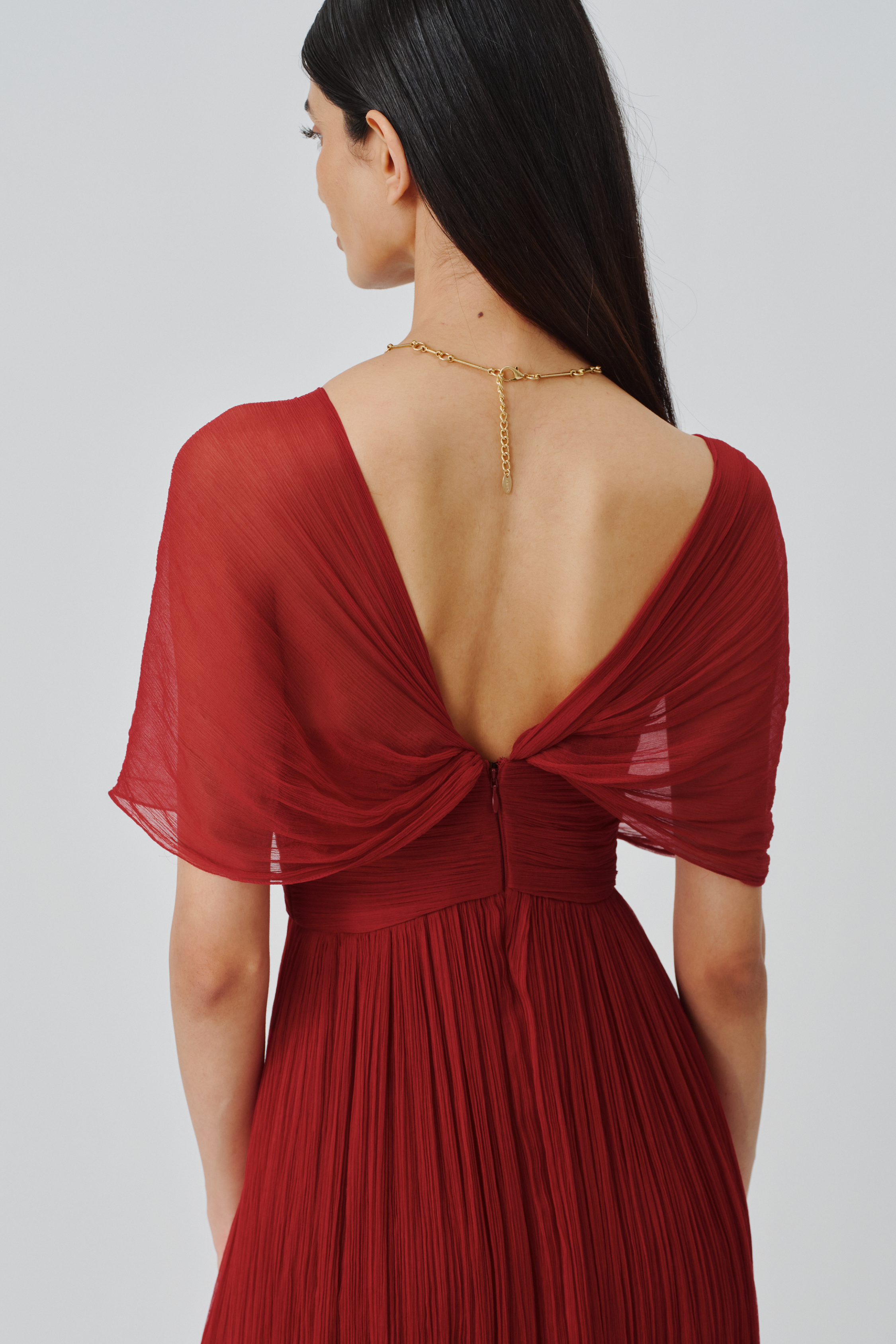 Close-up back view of the Scarlet Muse ruched gown top