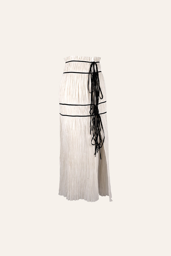 Amour halter neck top with black piping details and back tie-ups paired with Amour skirt in creme from Aroka.