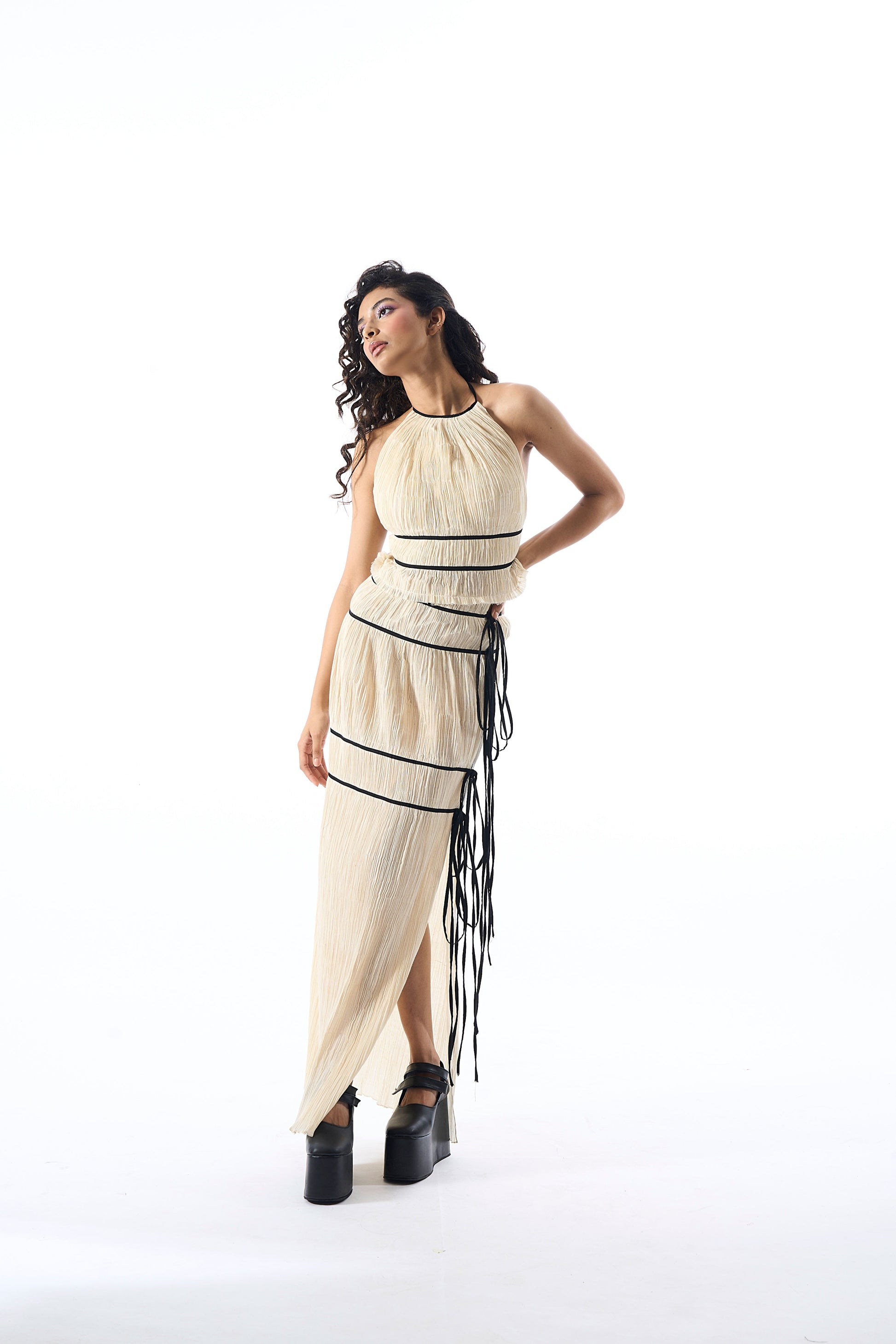Modal satin ruched halter neck top with back tie-ups and black piping details in creme by Aroka.