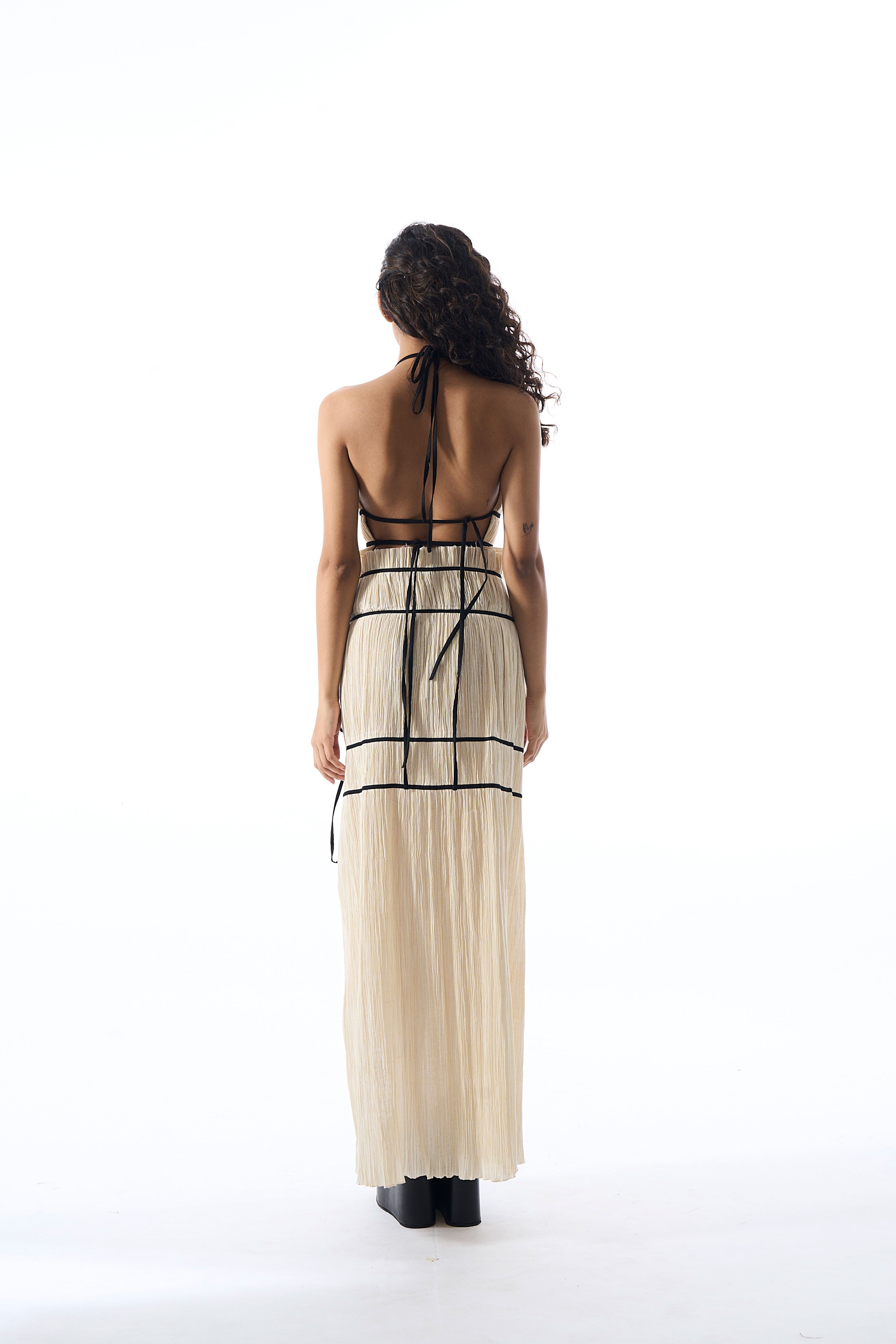 Modal satin ruched halter neck top with back tie-ups and black piping details in creme by Aroka.