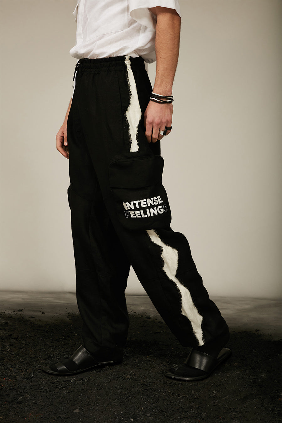 black linen pants with off-white frayed on one side