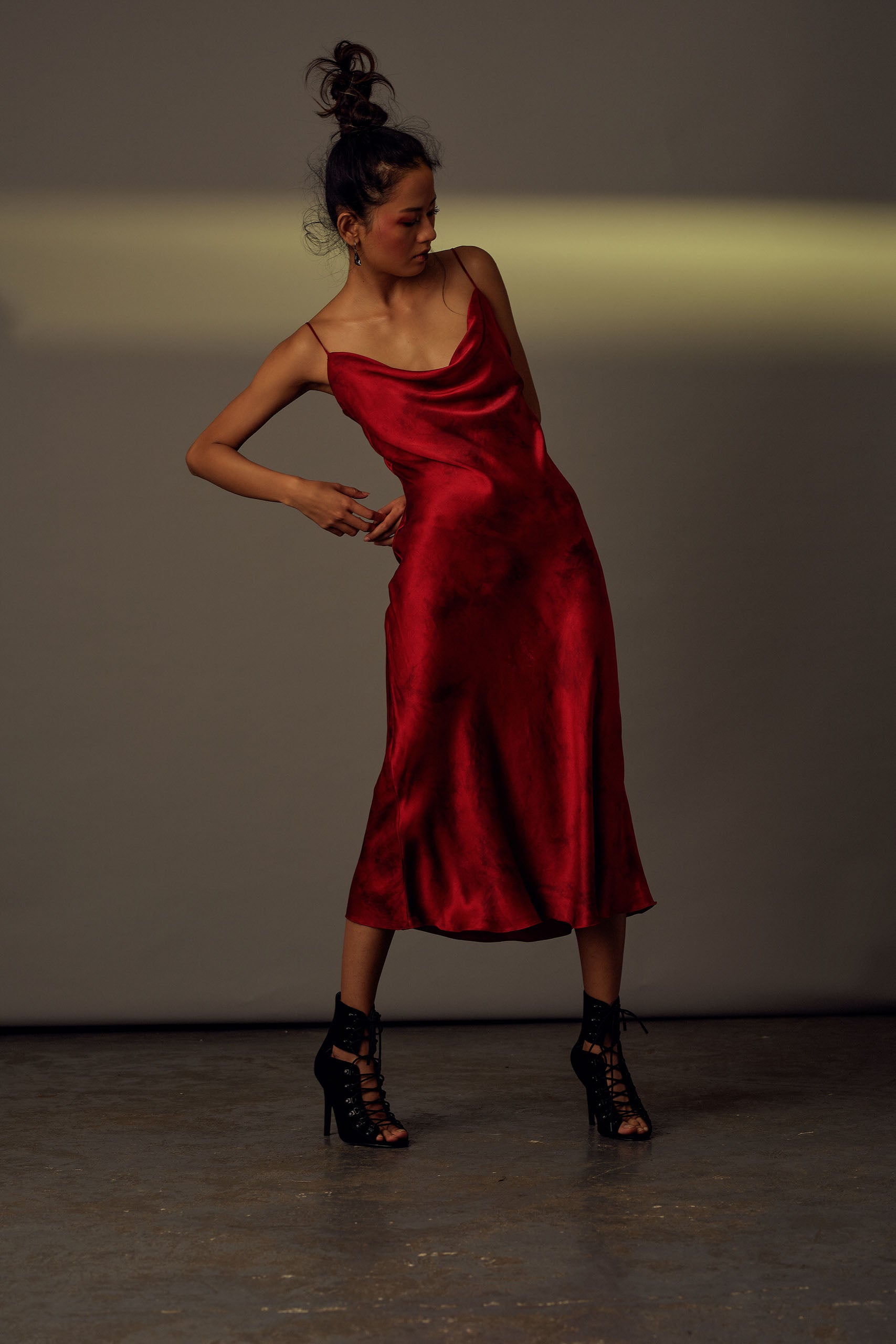 Slip dress with electric tie-dye patterns in red from Aroka.
